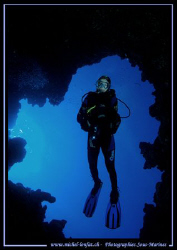Caroline my wife going down the crack in Dahab.... near t... by Michel Lonfat 